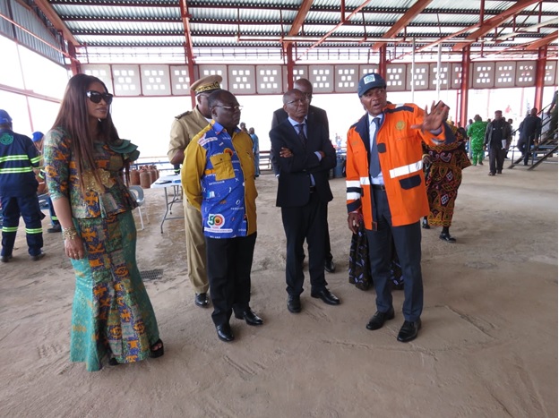 Authorities being explained how the process of filling each gas bottle